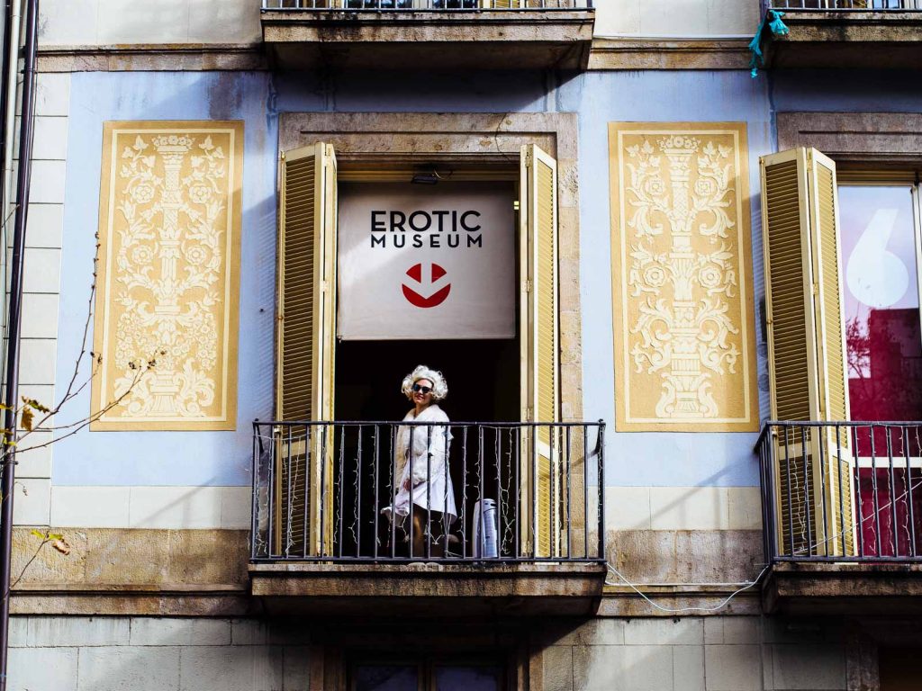 An impersonator of Marilyn plays her role from the balcony of the Erotic Museum at Las Ramblas in Barcelona